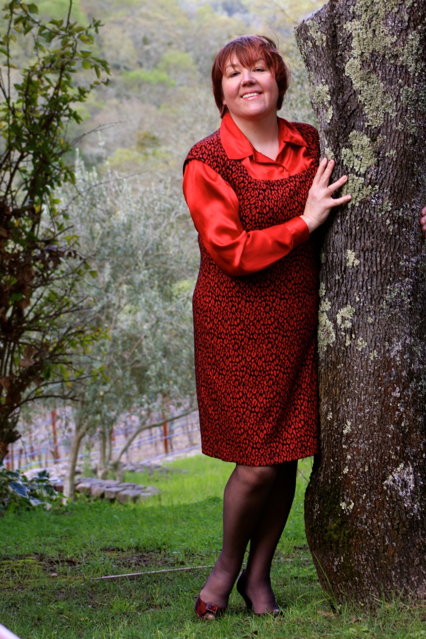 Portrait by a tree in red dress